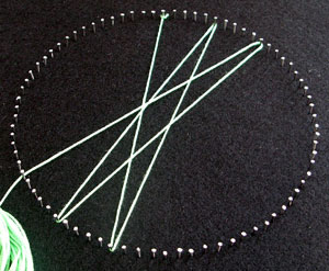 Tie the end of your first string on to the first nail.